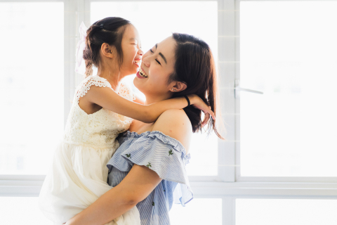A photo was taken at the client's home in Singapore capturing a special bond between a mother and daughter, showing their love and closeness.